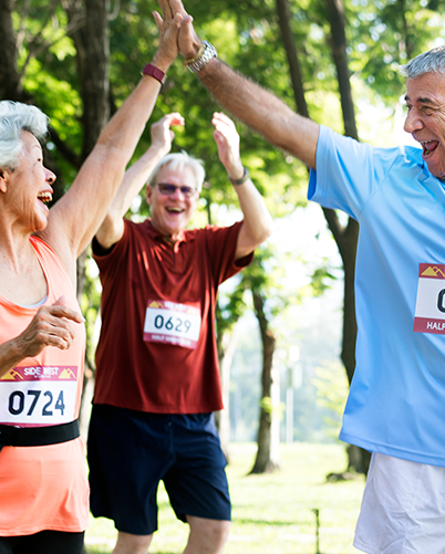 Older people high-fiving and cheering